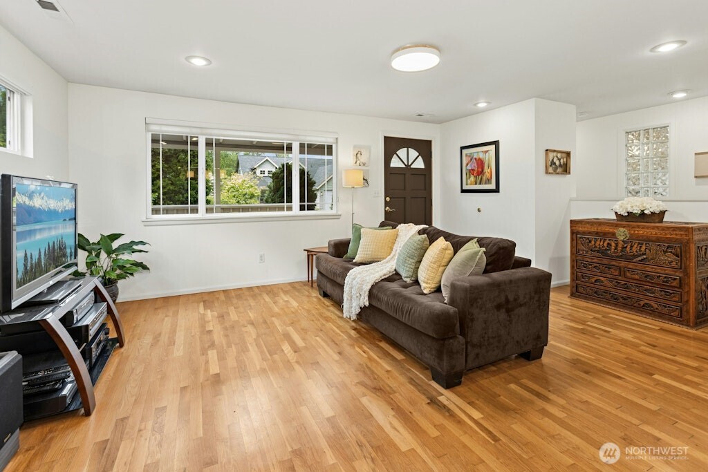 Light and bright family room is open to the kitchen and sunroom/dining areas