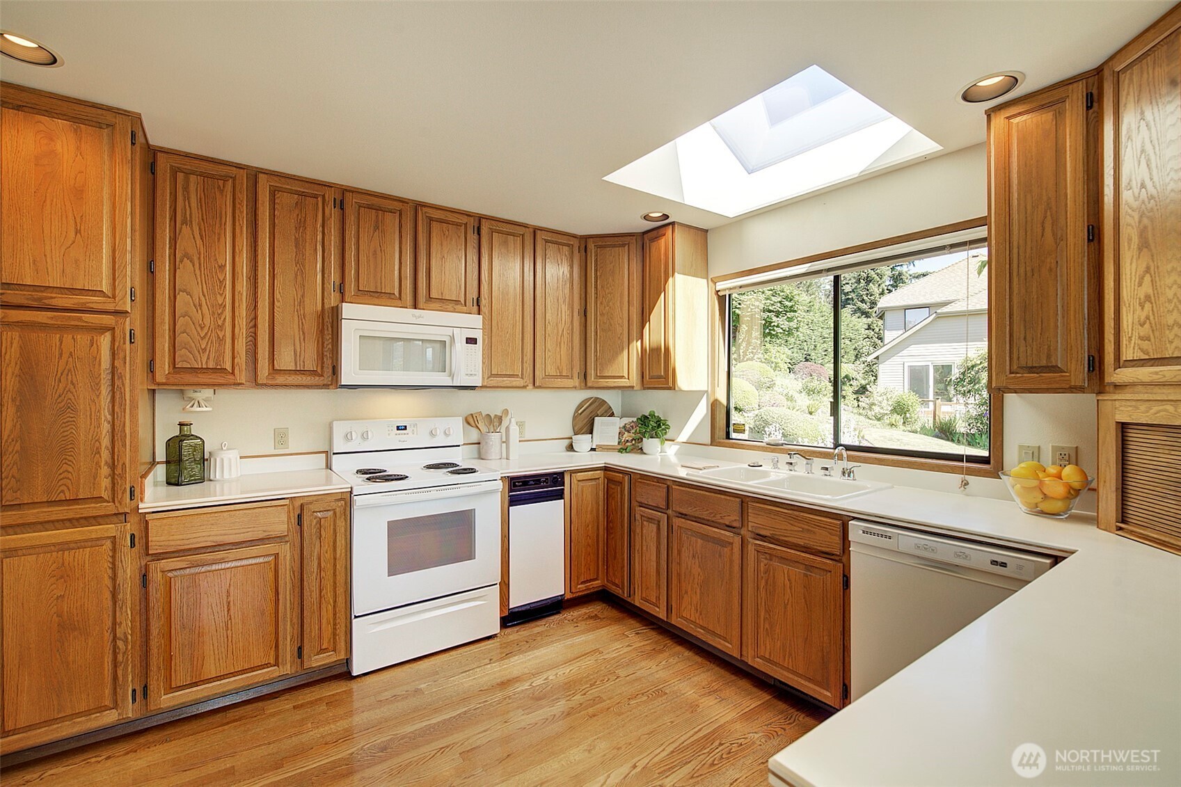 Roomy kitchen with skylight.