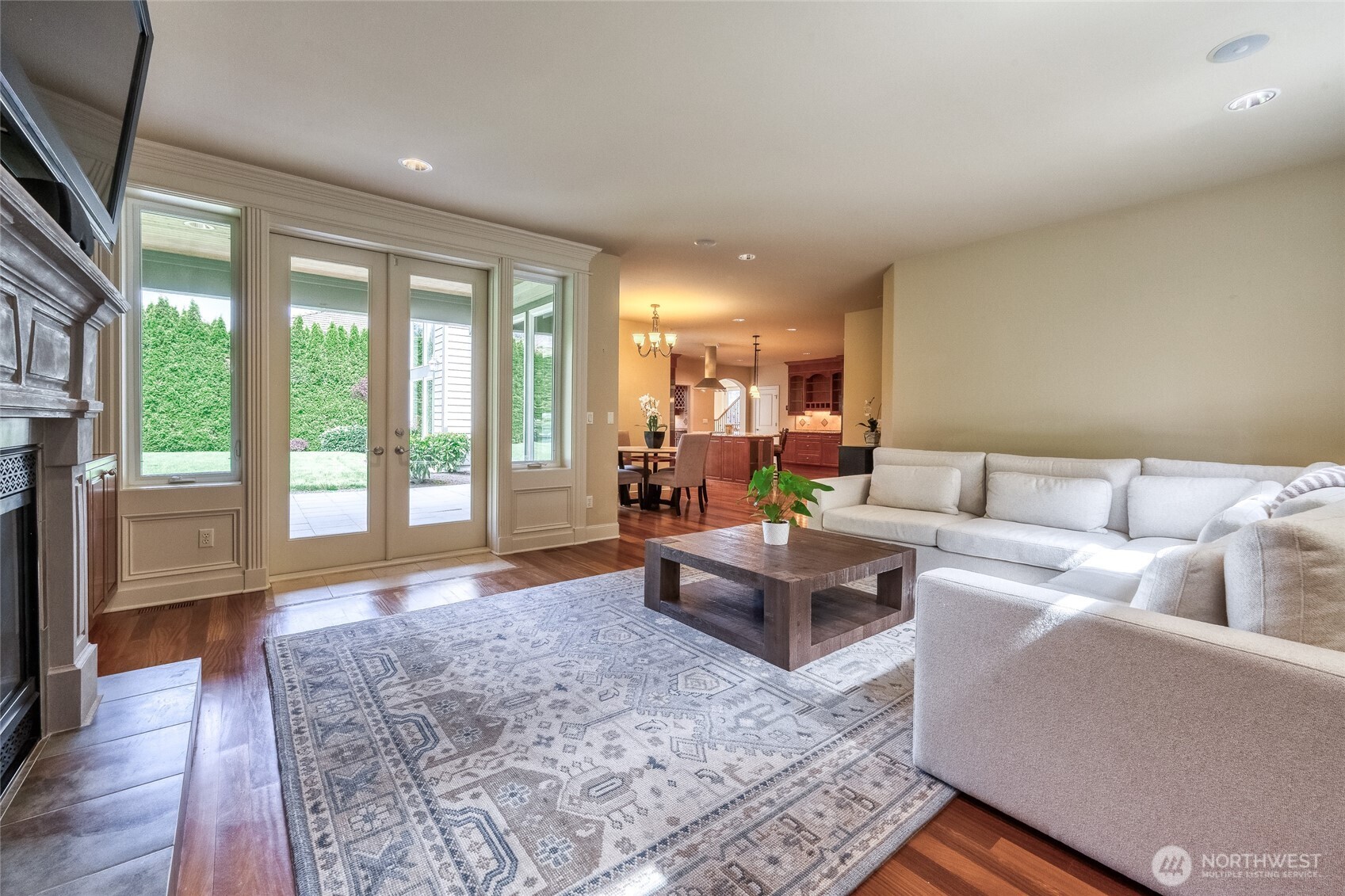 French doors open to a covered patio, which is plumbed for gas and ideal for outdoor entertaining.