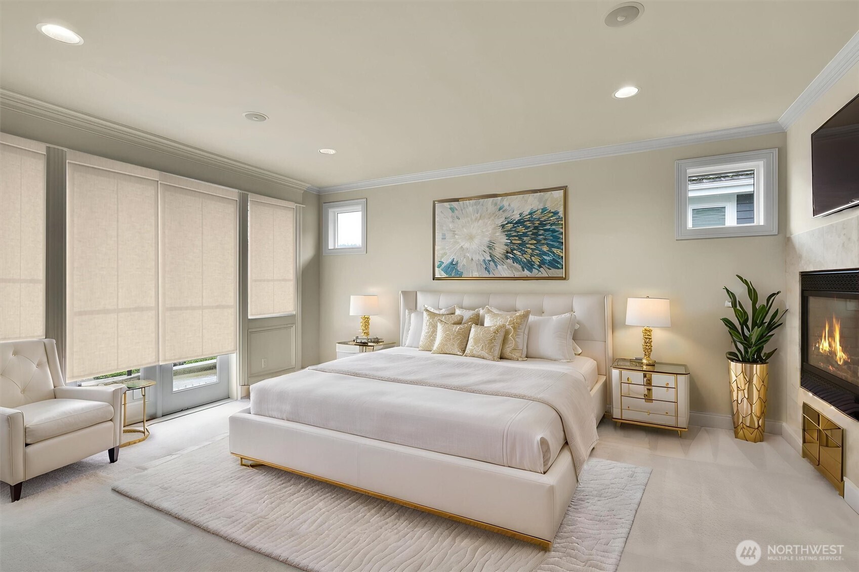 Retreat to the elegant primary suite featuring a private balcony, and a stunning double-sided gas fireplace . - Virtually staged