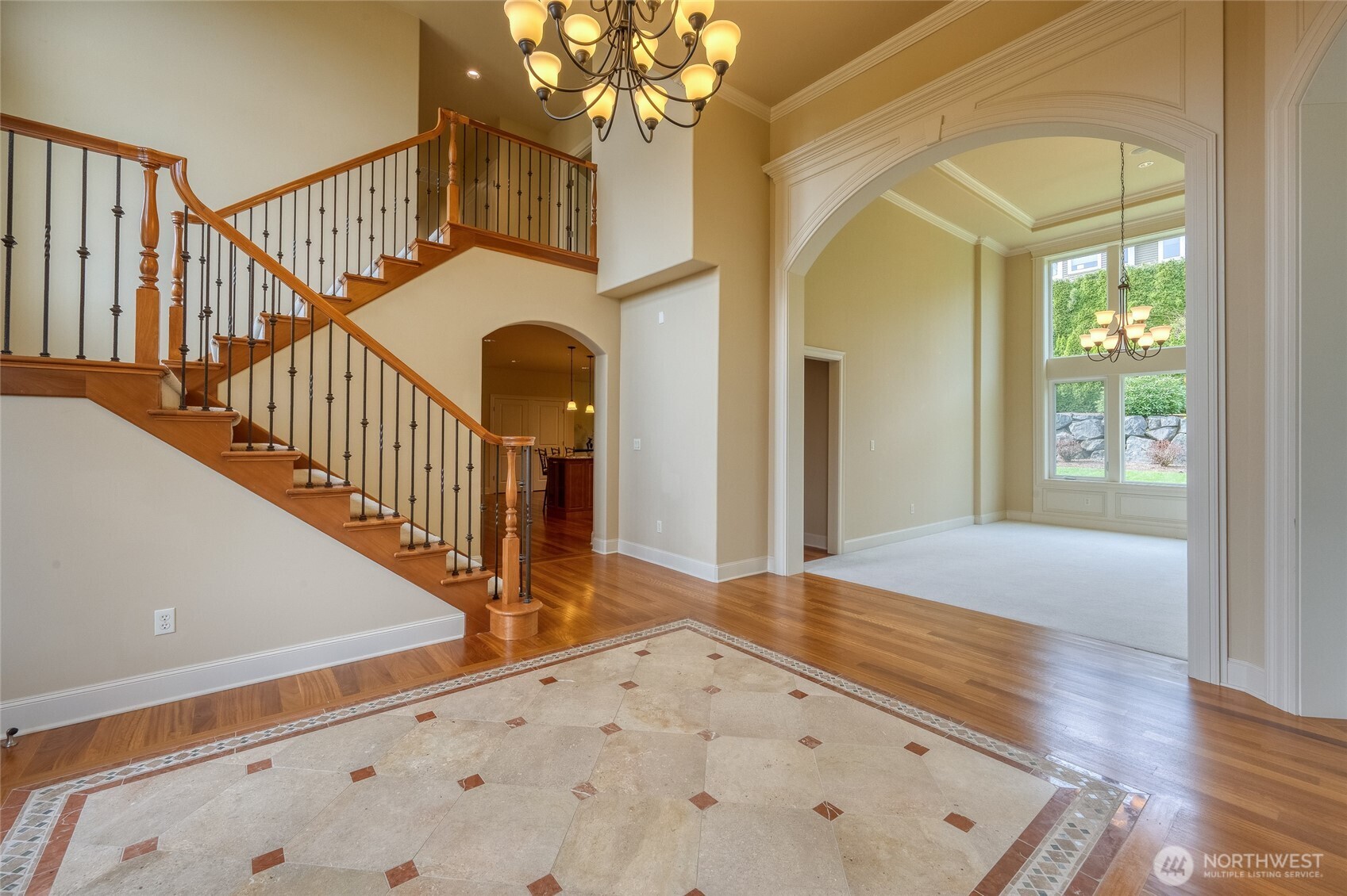 Exquisite home showcasing timeless design and beauty, highlighted by Brazilian hardwood flooring and elegant marble inlay details that create a sophisticated and luxurious atmosphere.