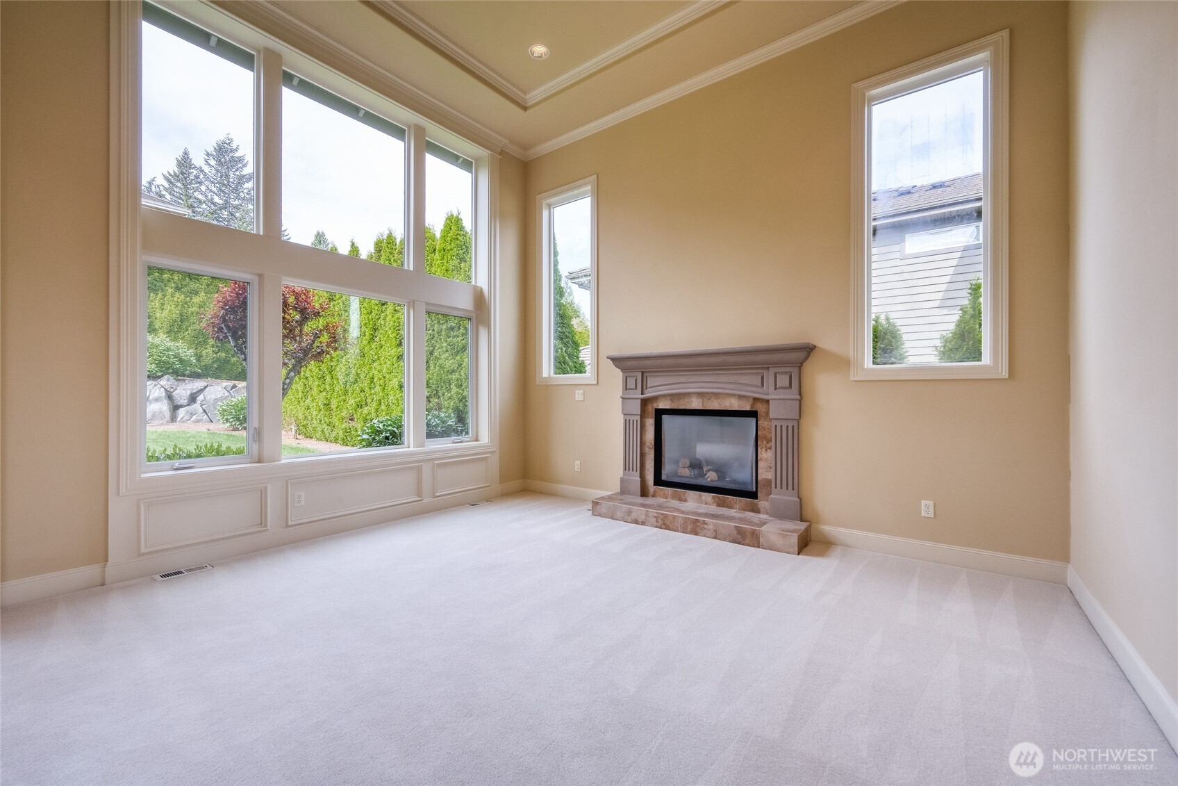 The elegant living room features a cozy gas fireplace.