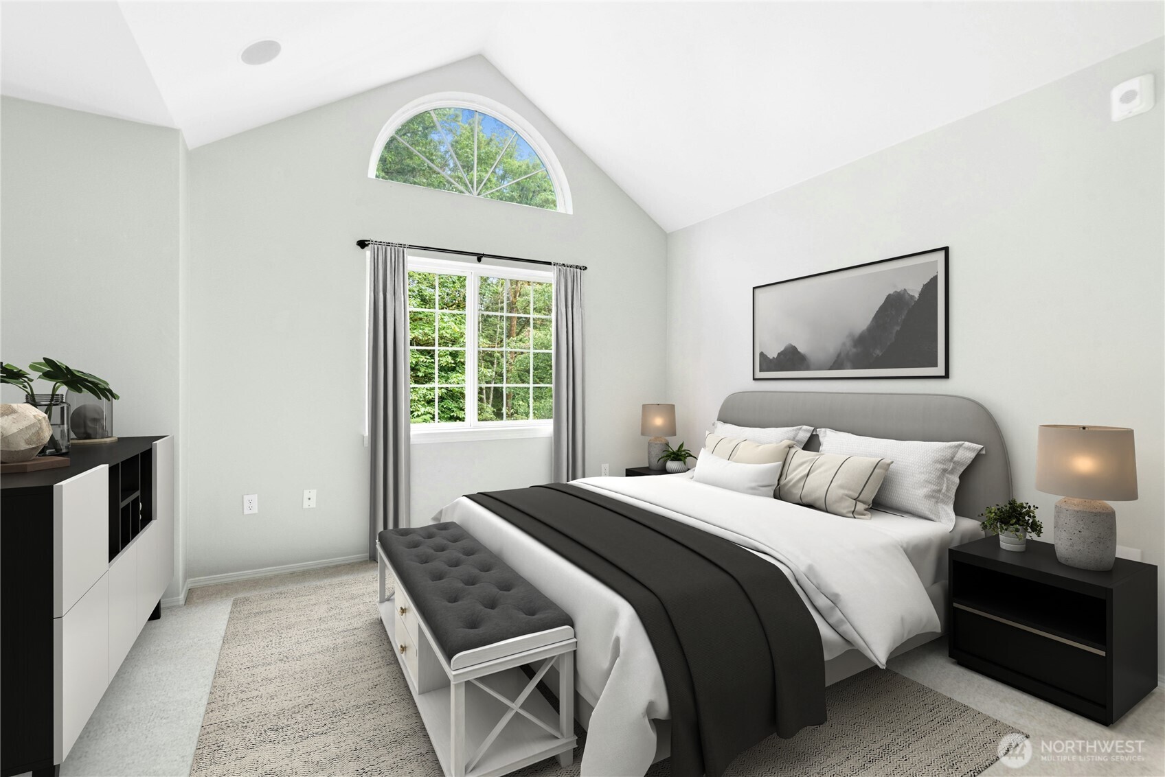 Virtually Staged - Primary bedroom with vaulted ceilings, abundant natural light, and an arched window.