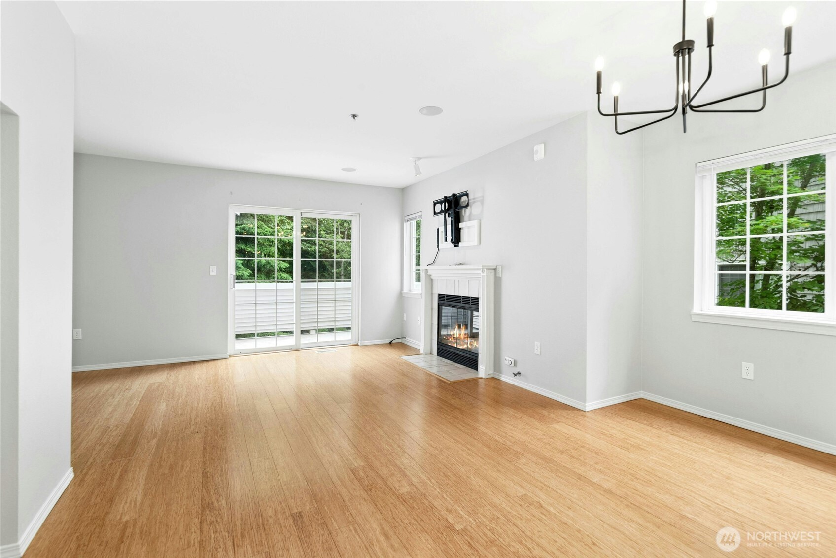 Open floor plan offers comfortable flow between the living room, dining area, and kitchen.
