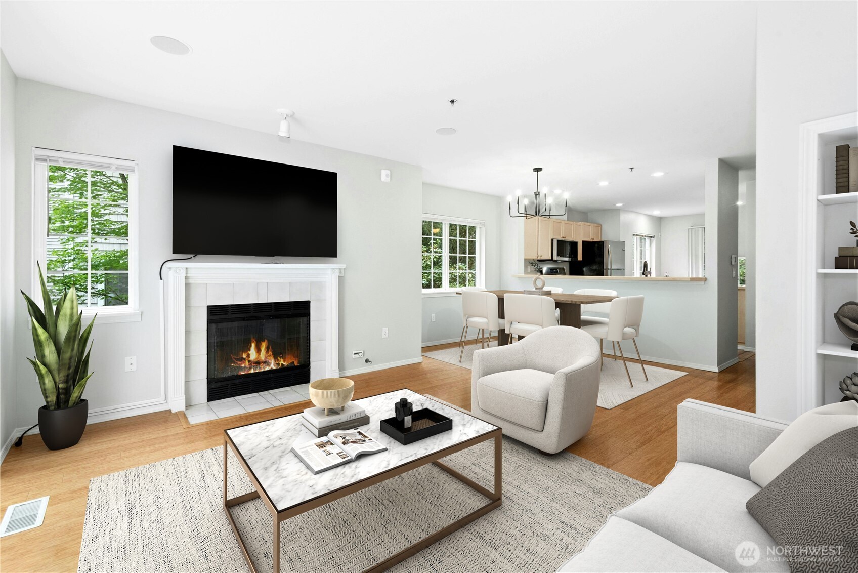 Virtually Staged - Bright living room with vaulted ceilings, gas fireplace, and abundant natural light.