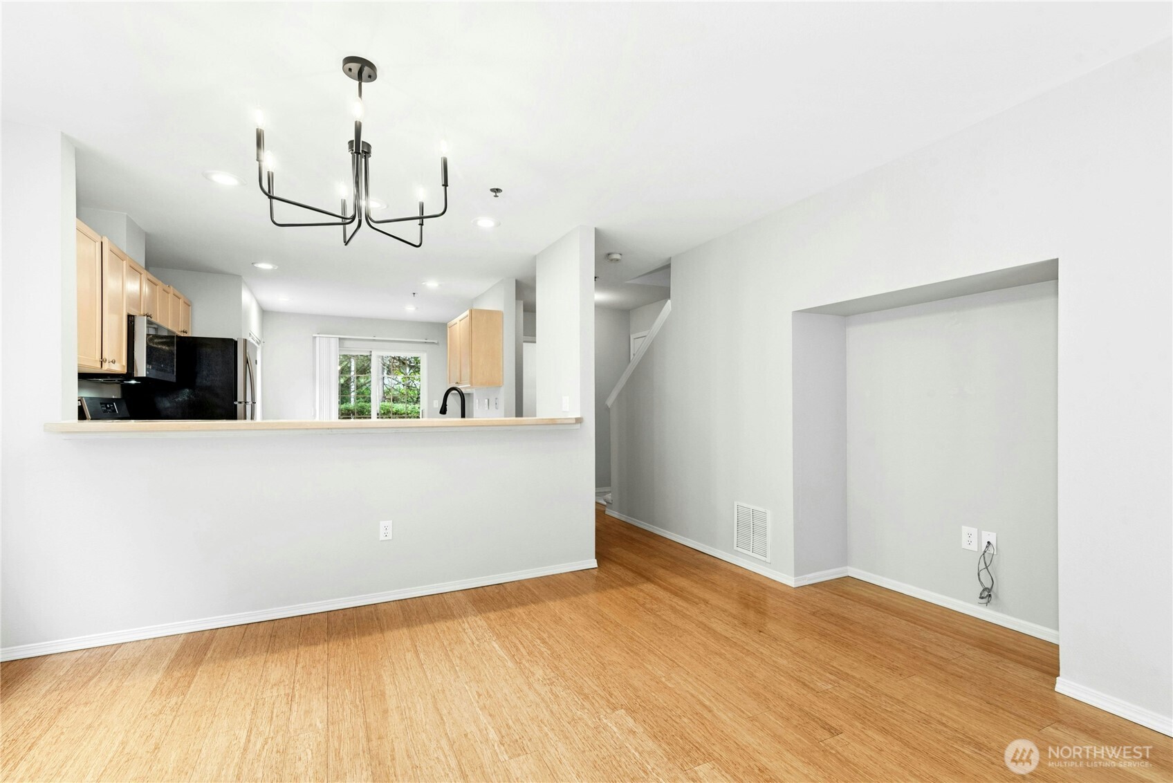 Open-concept main floor with connected living, dining, and kitchen spaces.