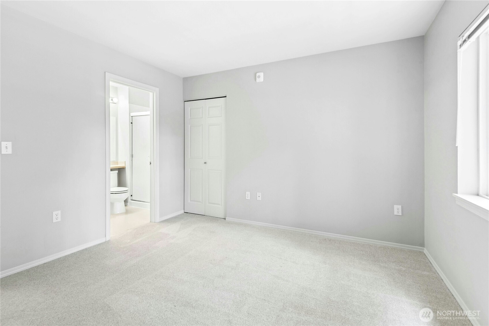 Alternate view of the second bedroom, ideal for guests, a home office, or both.