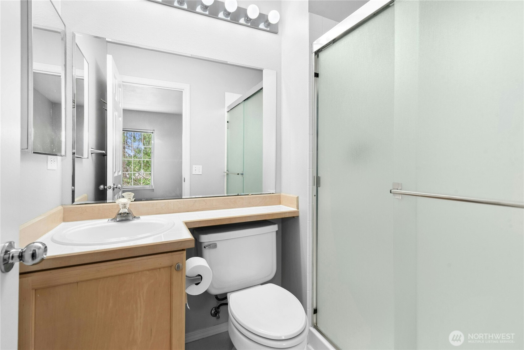 Second  bathroom with vanity and tub/shower combination.