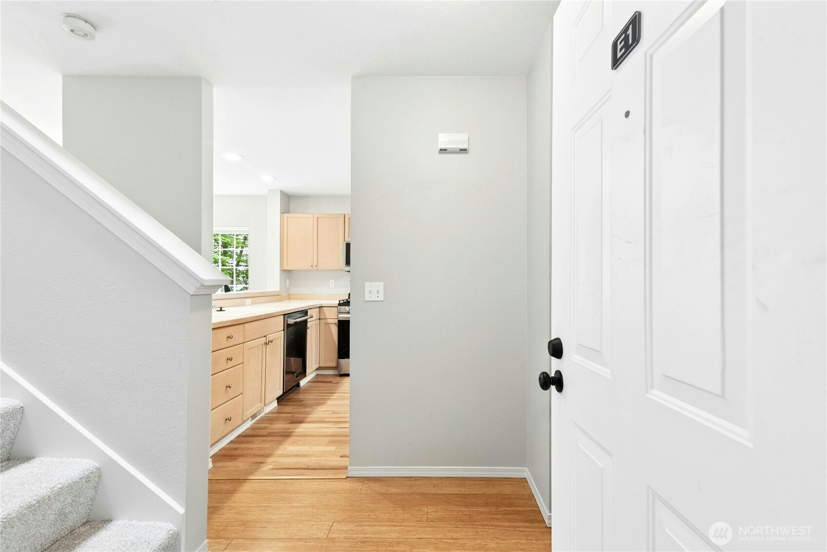 Entry foyer with staircase leading to the upper-level bedrooms.