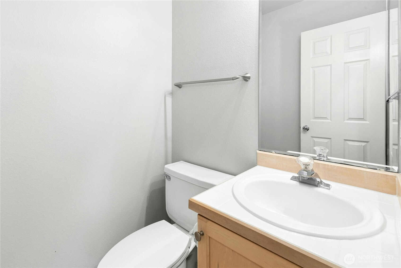 Main floor powder room conveniently located near the entry.