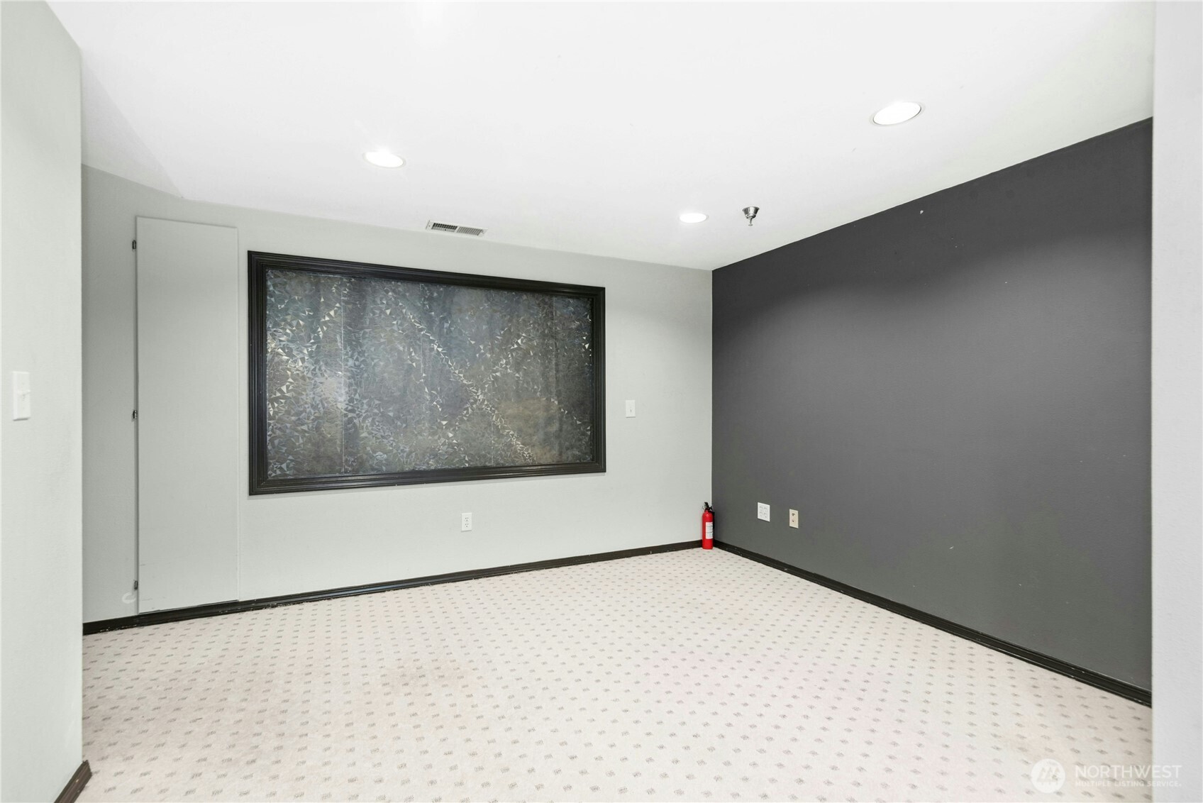 Alternate view of the finished lower-level flex space with abundant room for a variety of uses.