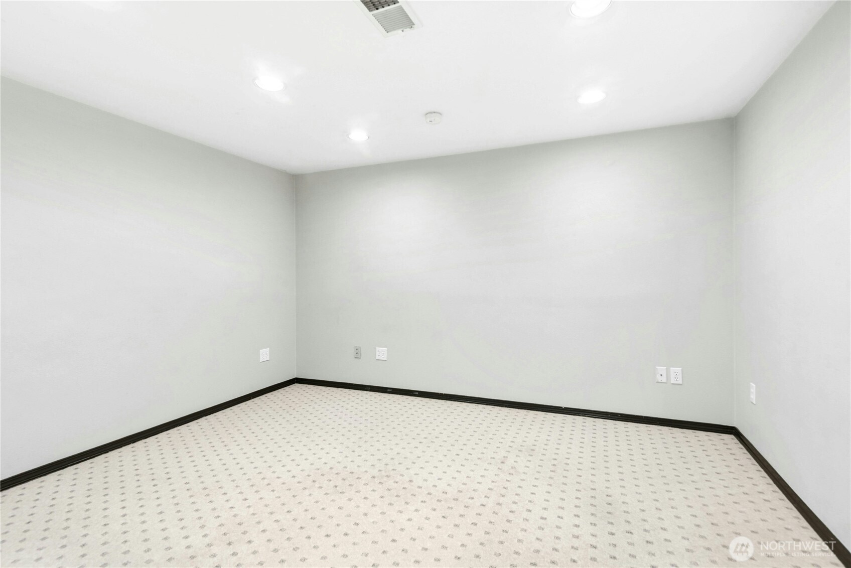 Additional finished room within the lower-level flex space.