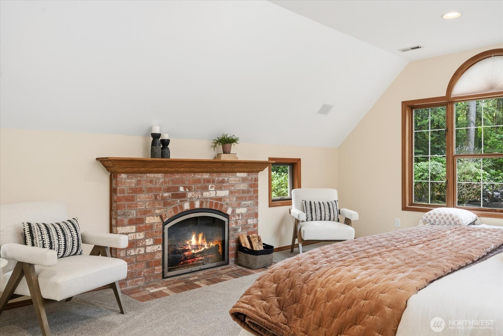 Cozy fireplace in primary bedroom