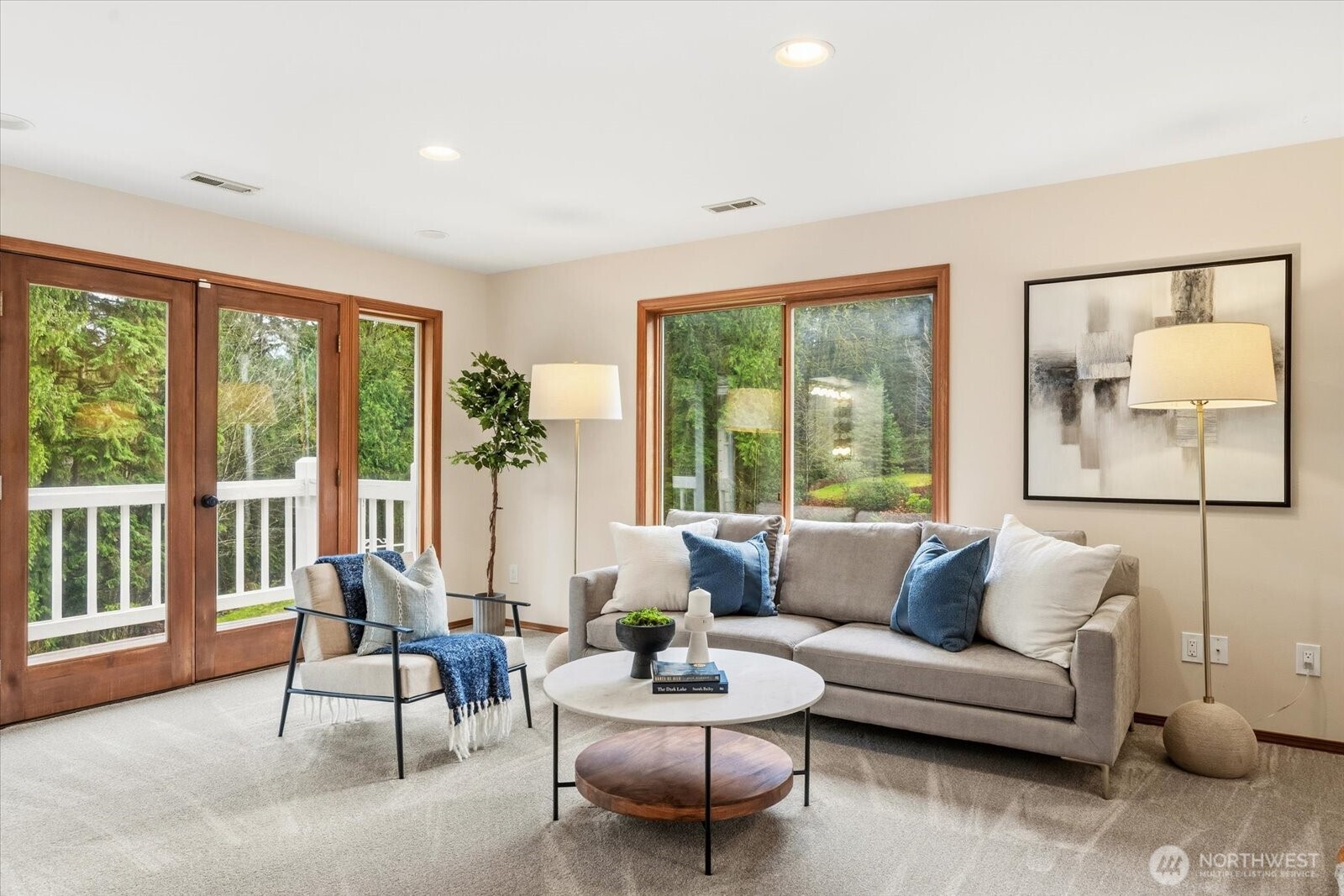 Sitting area and private balcony off of primary bedroom