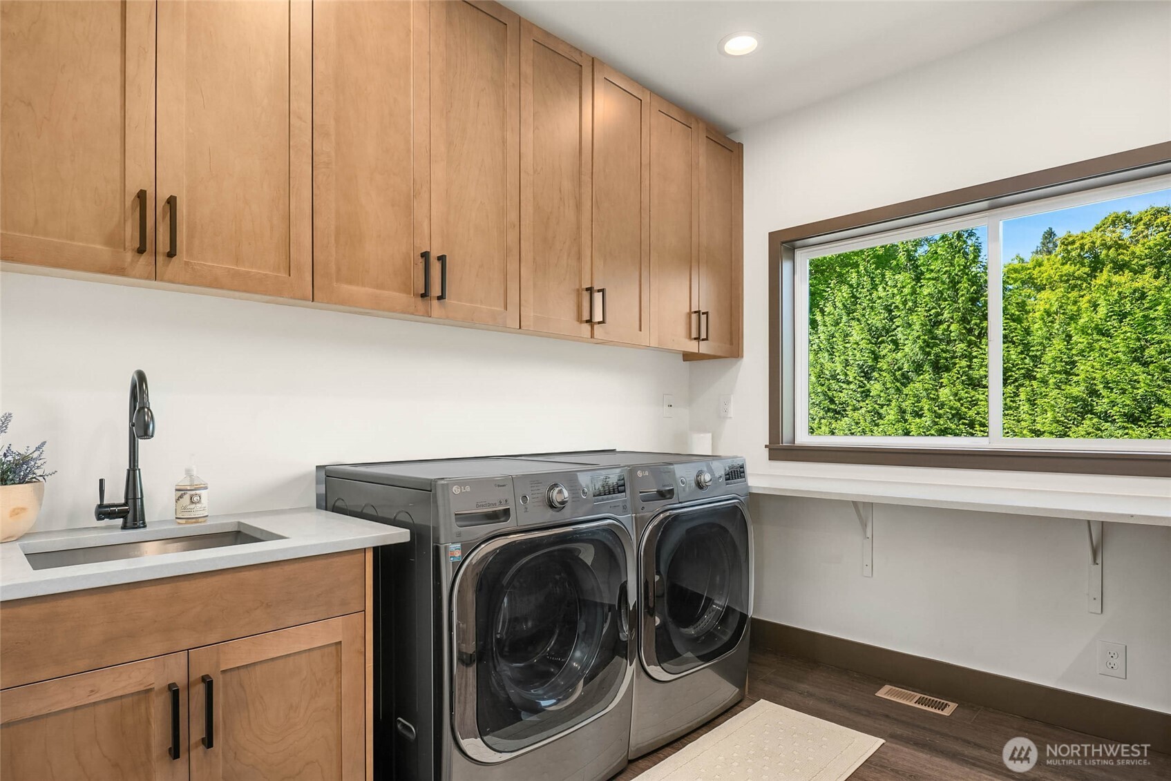 Broom closet on other side positioned to hide a countertop area for work/crafts etc.