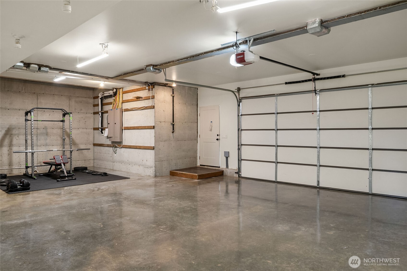 Two 220V Electrical Boxes. Two car garage finished + shop with sealed floors. .