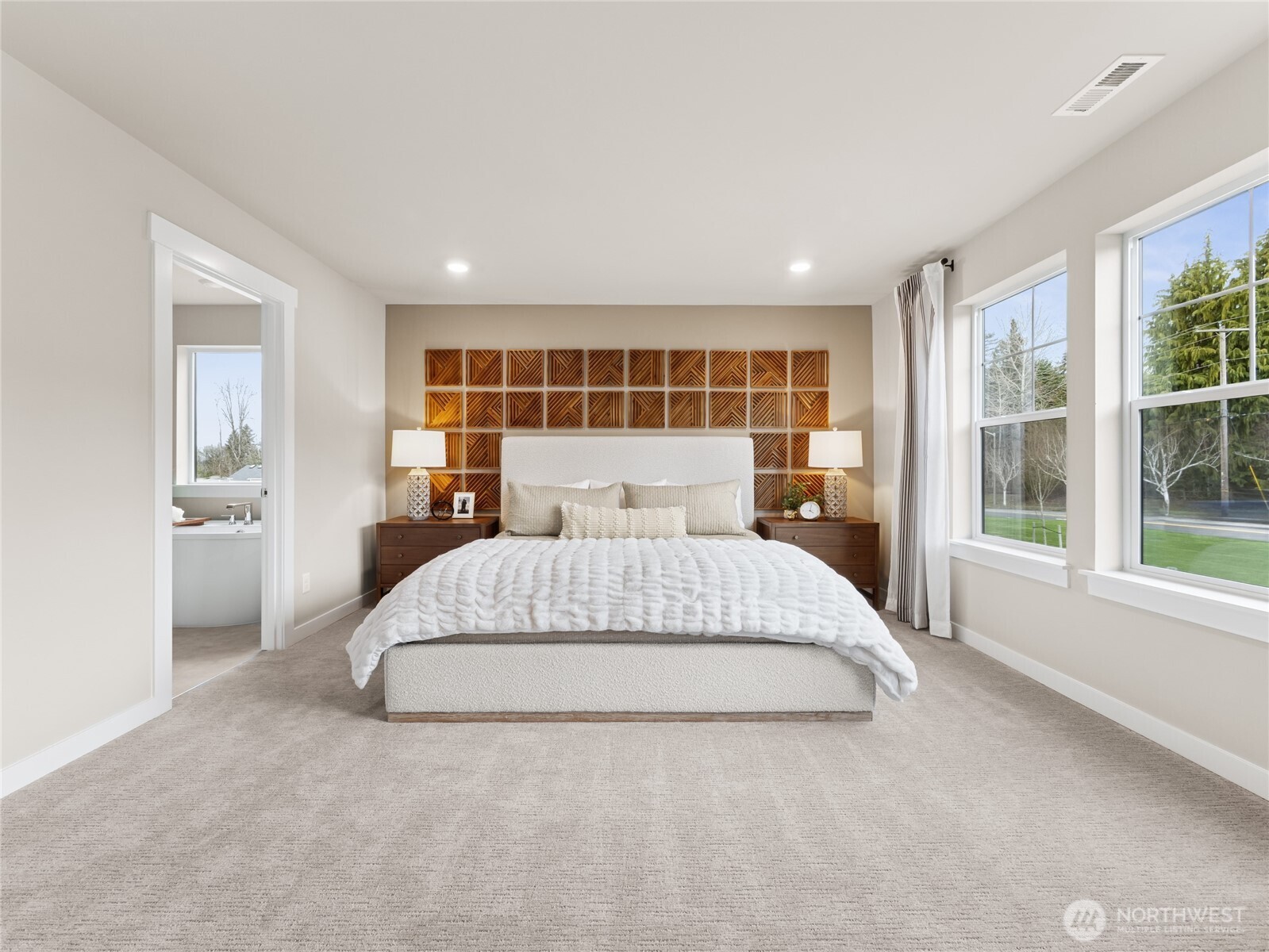Spacious primary bedroom with attached 5-pc bath. Photo is representational. Actual home is under construction and finishes and paint colors may vary. See site agent for details....