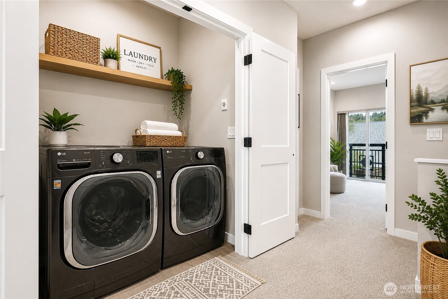 Virtual Staging Pic of the laundry room located conveniently across from the bedrooms!  Like new upgraded washer and dryer included with the home!  Xtra reading nook across from laundry!