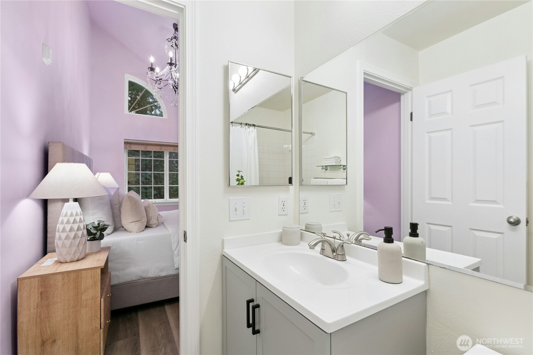 Ensuite bath connected to primary for maximum convenience and privacy.  Purple walls have been painted white.