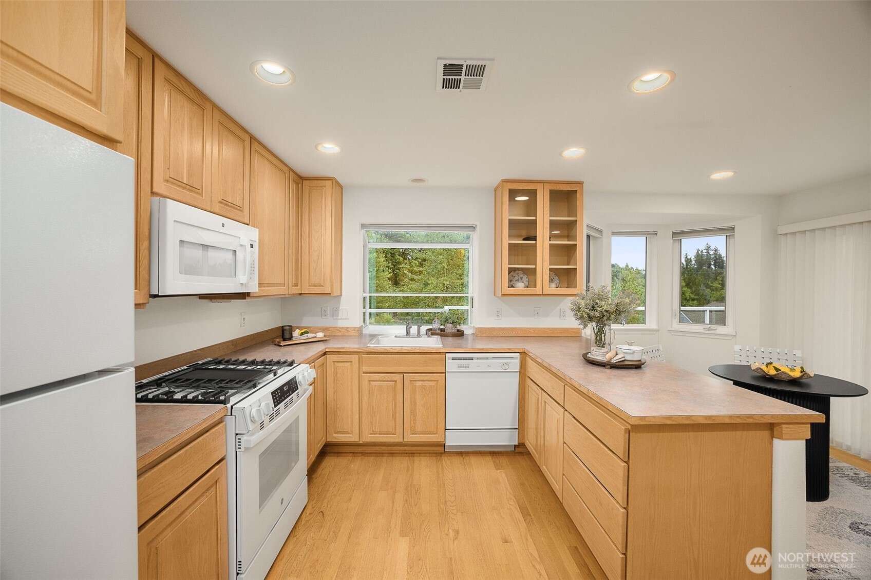 New stove and double ovens in this large open kitchen