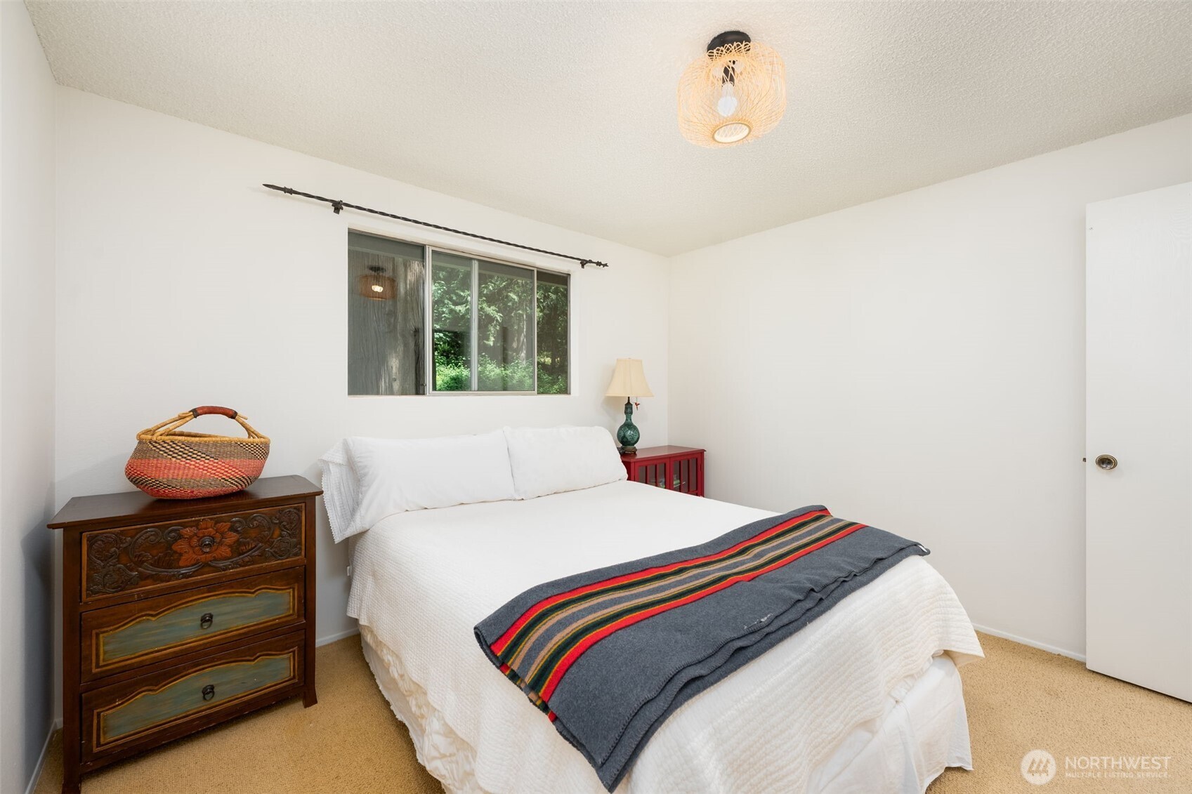 The primary bedroom backs up to the yard making it easy to listen to the babbling creek as you venture off to sleep in the evenings.