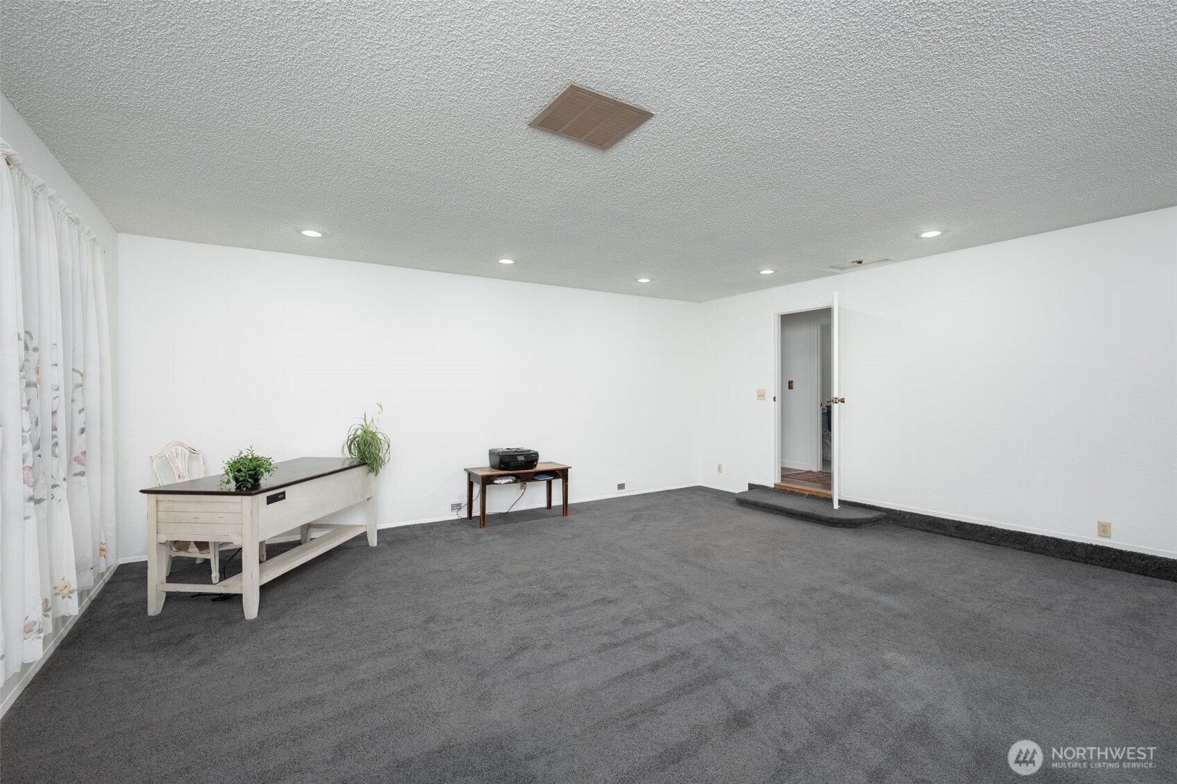 This large bonus room has its own entrance on the side of the home making it easy to host guests or have a business ran from home.
