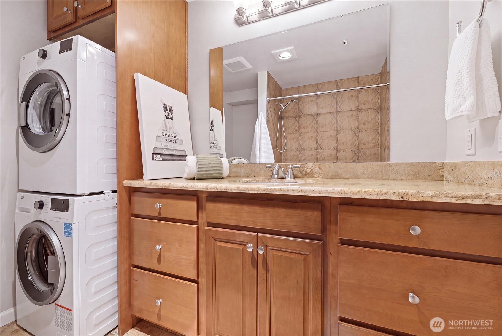 Stacked washer/dryer, updated cabinets, lighting.