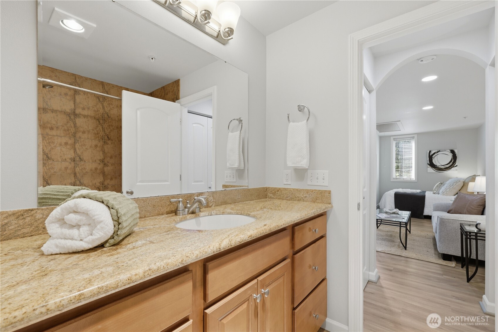 Entry to the bathroom is location for water heater, closet storage.