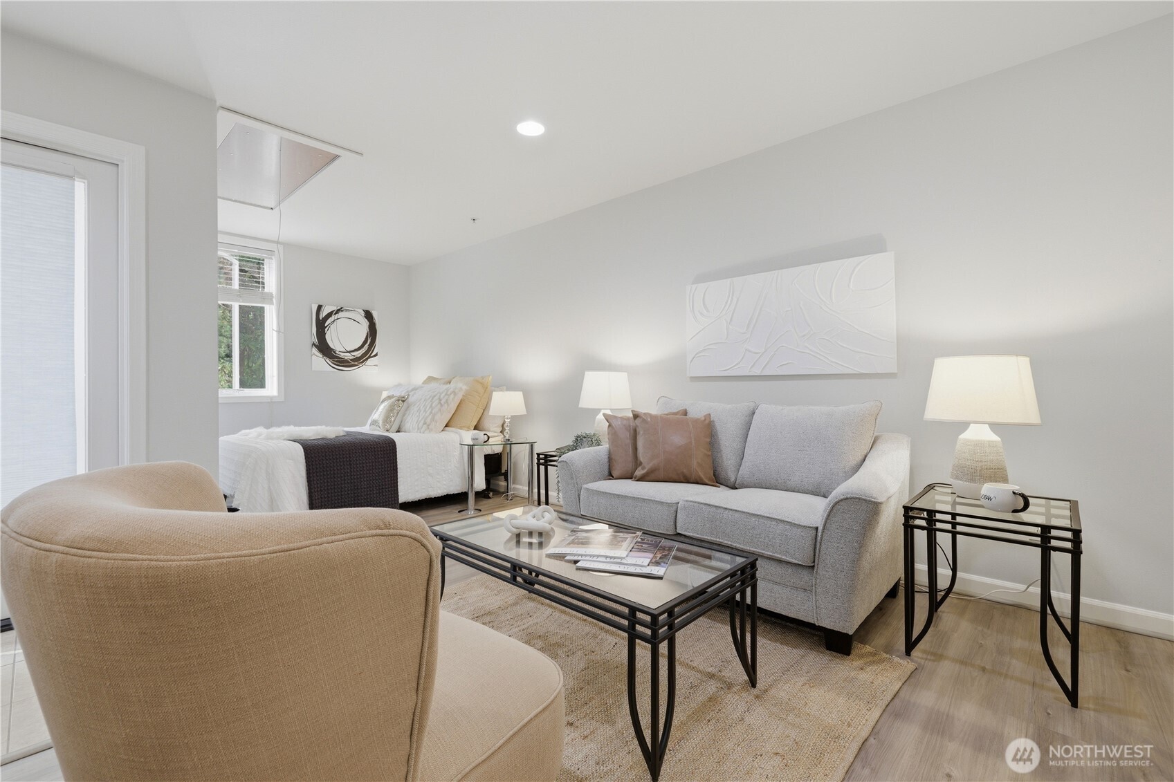 Laminate plank floors, recessed lighting, fresh paint add to the welcoming style.