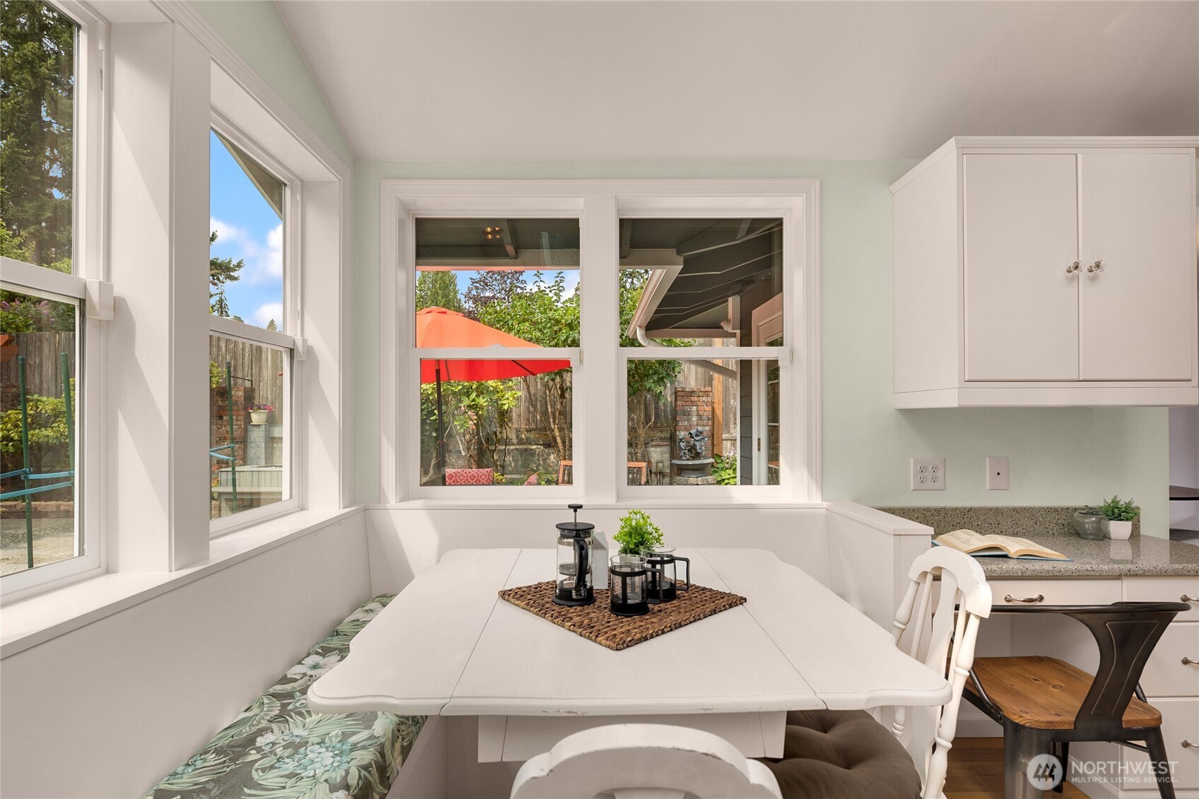 Comfortable built-in seating with views of the completely private backyard.