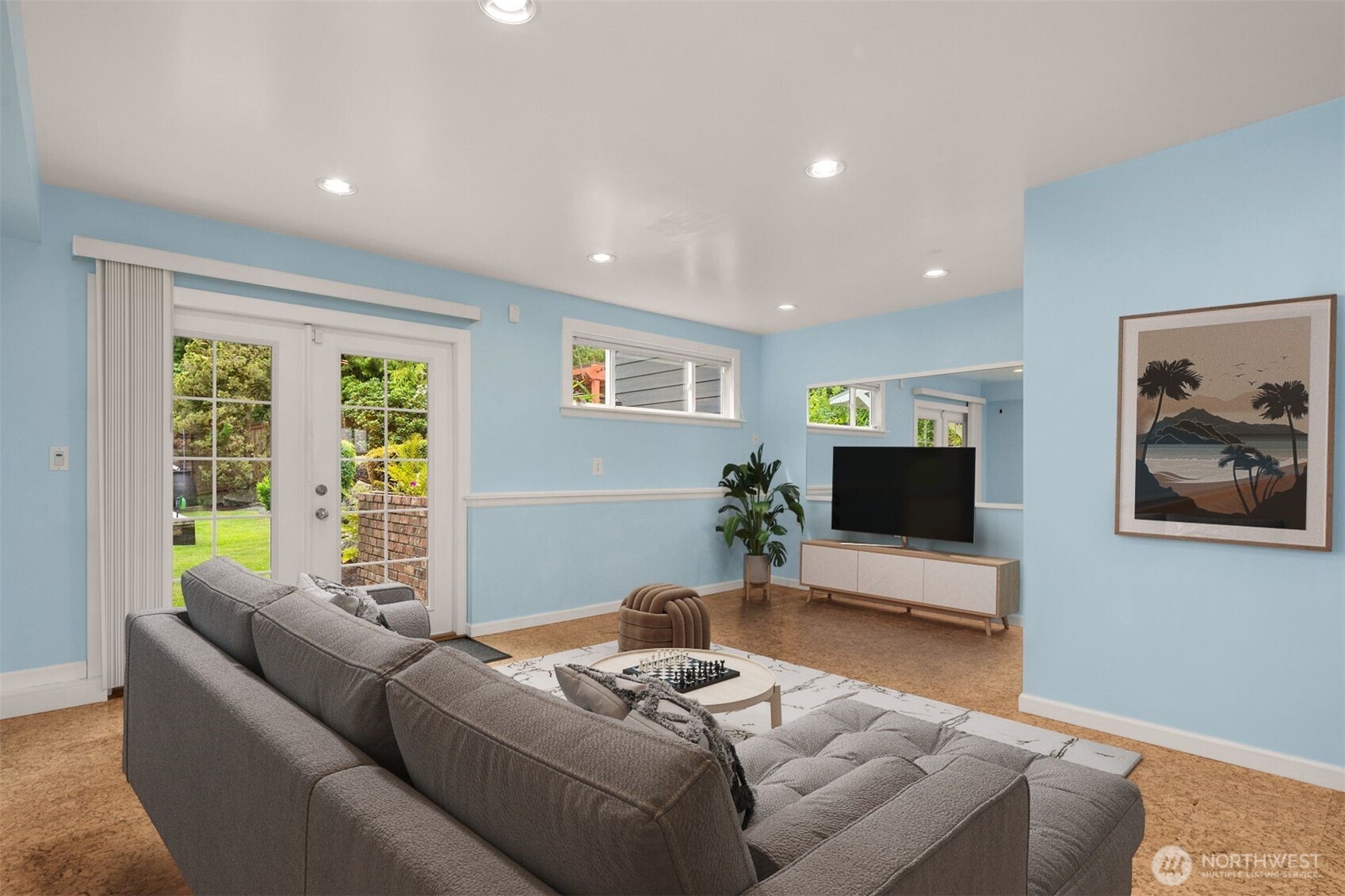 Virtually staged. There is so much space here! You can turn it into a large media room or family room with exercise area....so many options. Virtually staged as a media room.