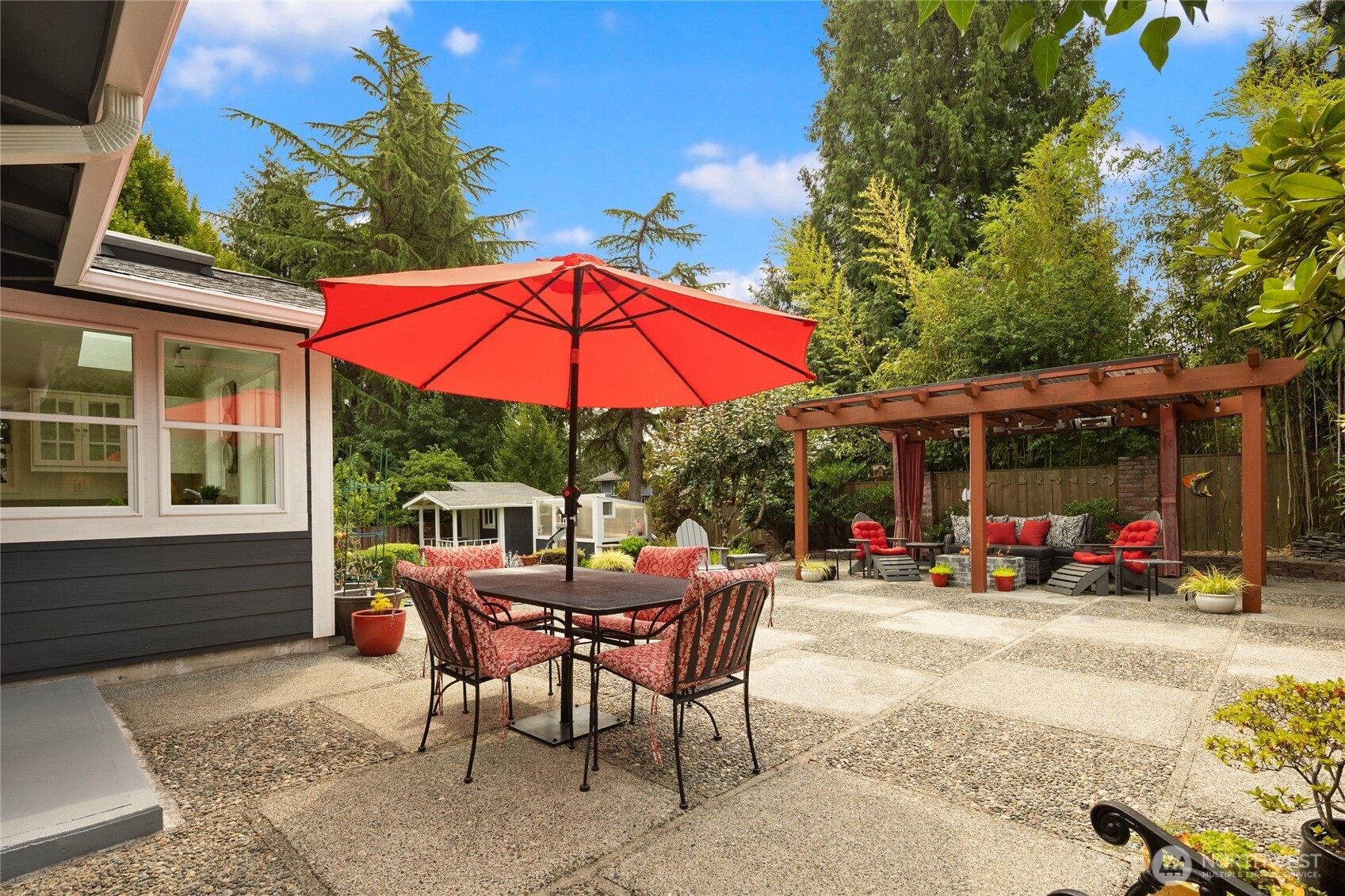 A backyard oasis like no other- Water features with soothing sounds, a pergola with a gas fireplace & heaters and  lights. Also don't miss the built-in bbq, garden shed, and outbuilding.