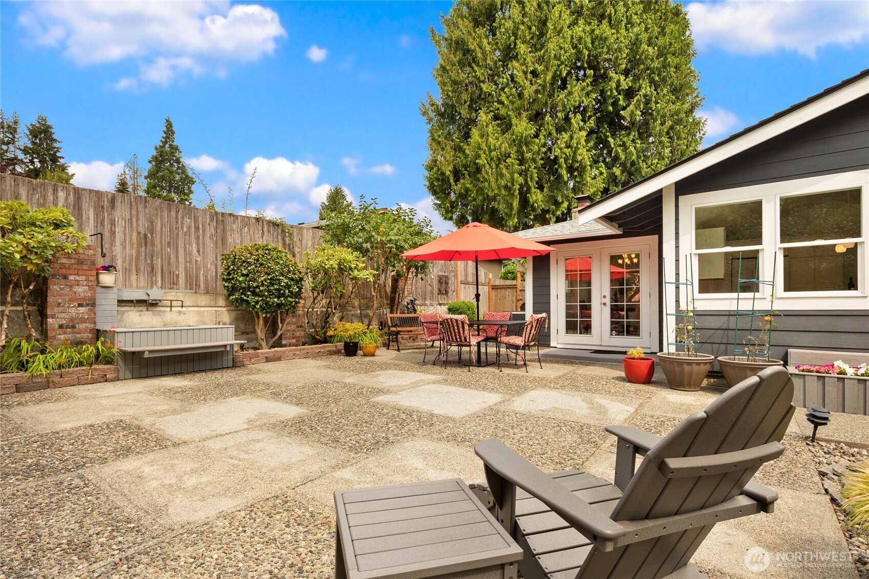 Another water feature along the fence provides a peaceful back drop and the large patio allows for multiple furniture arrangements.