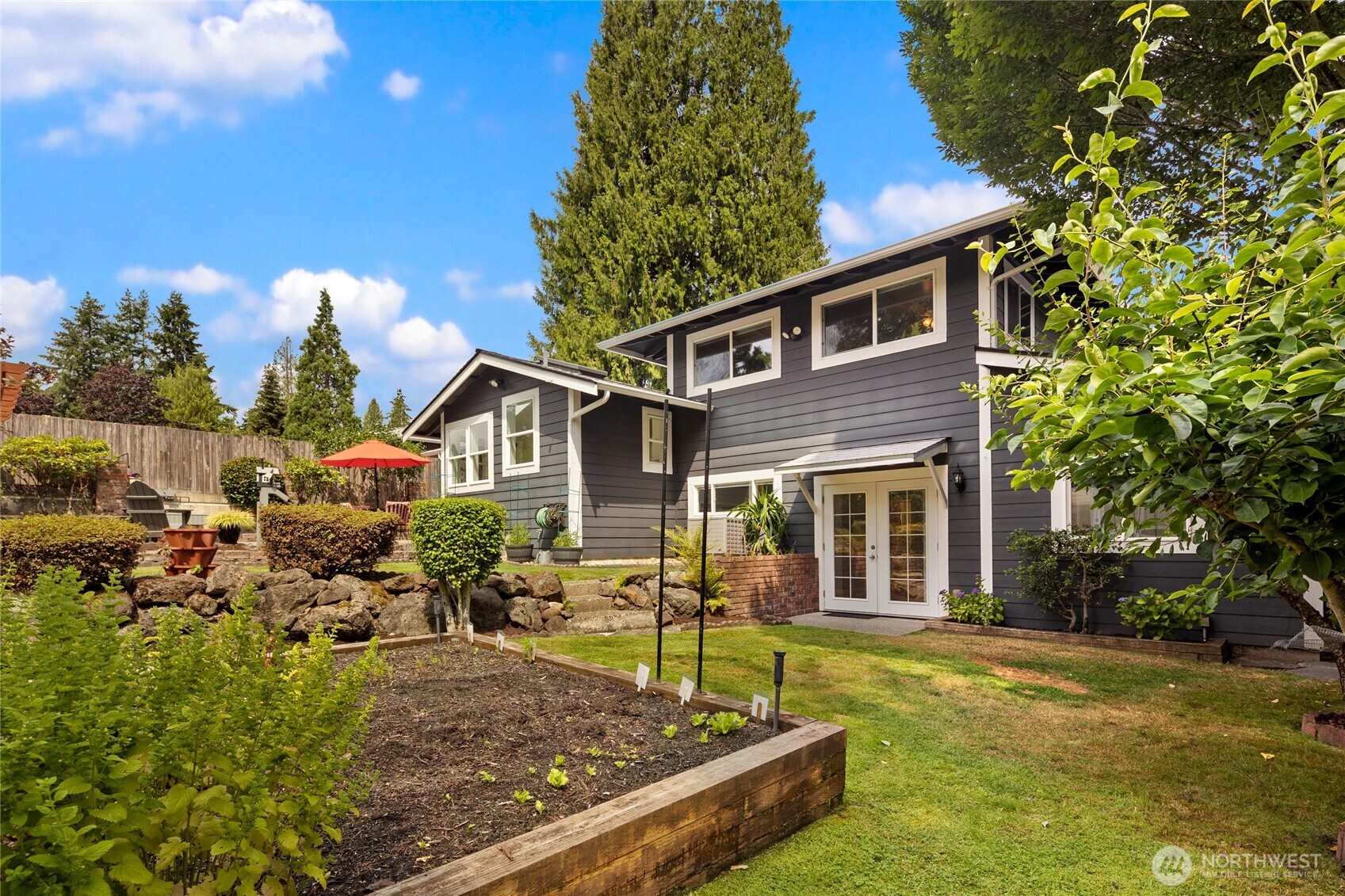 Garden beds and easy access to this gardening area from the lower French doors off the family/rec room.