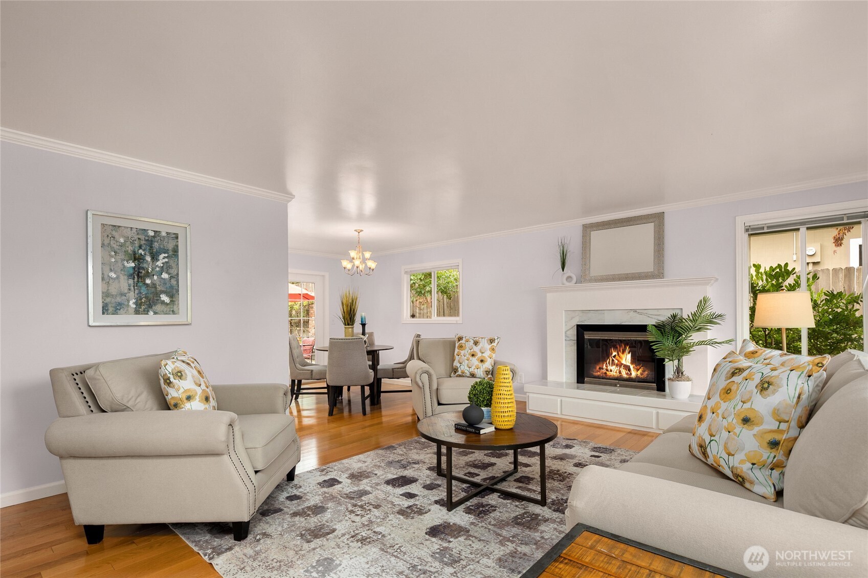 The living room flows naturally to the dining room. Notice the gorgeous hardwood floors!