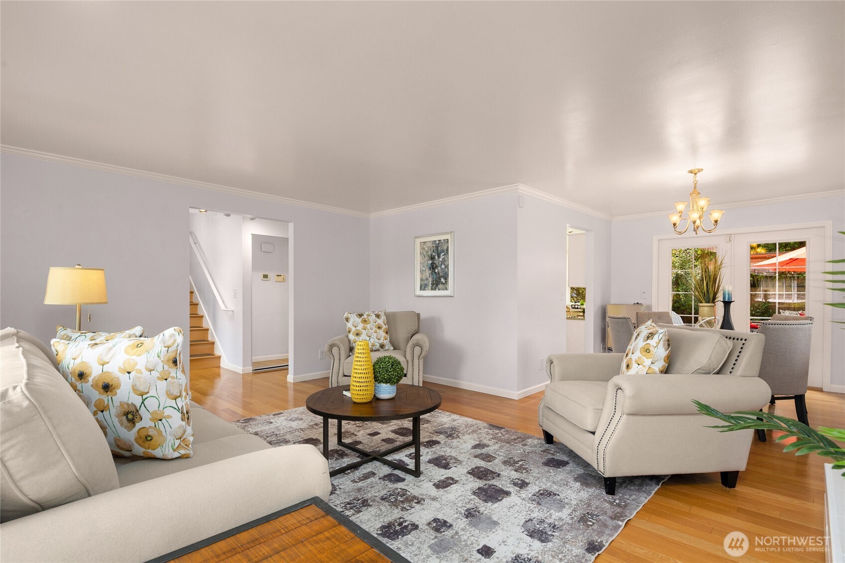 Another angle of the space to show the flow of the main floor. Notice the French doors to the patio to the right of the photo.