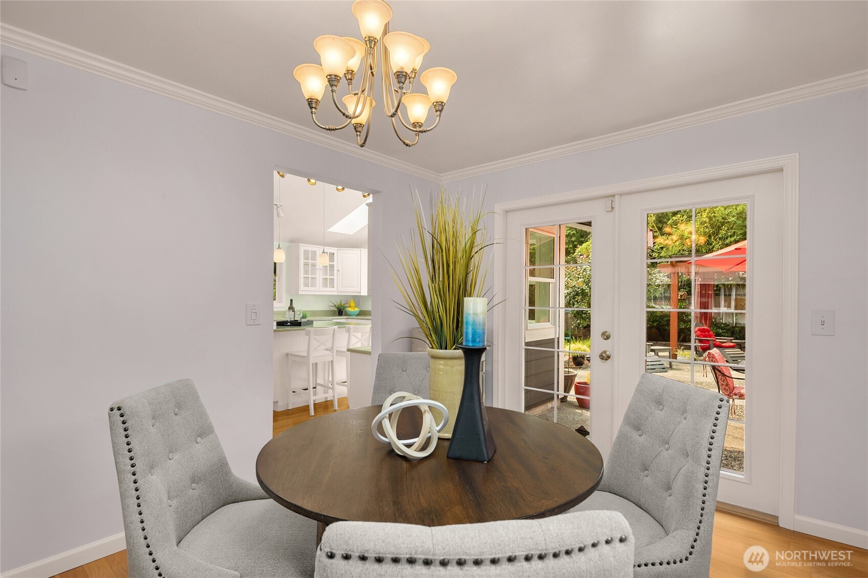 Ideally located next to the kitchen and the patio. Outside the French doors is a built in gas grill! Entertaining & BBQing are easy!