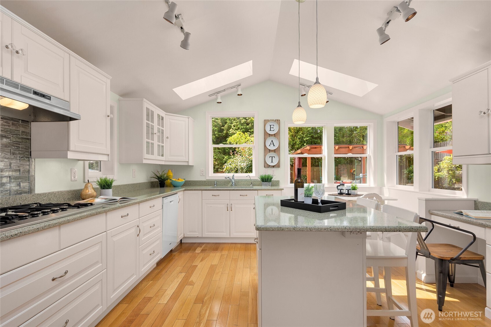 Cheerful & bright this updated kitchen will delight the chef in the home. The island has bar stool seating for quick meals and a built-in kitchen breakfast is perfect for casual & cozy dining.