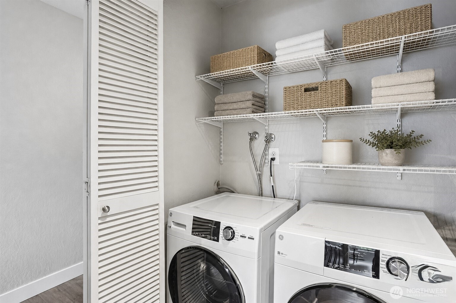 Virtually staged for ideas, However Laundry room comes with newly stainless steel appliances.