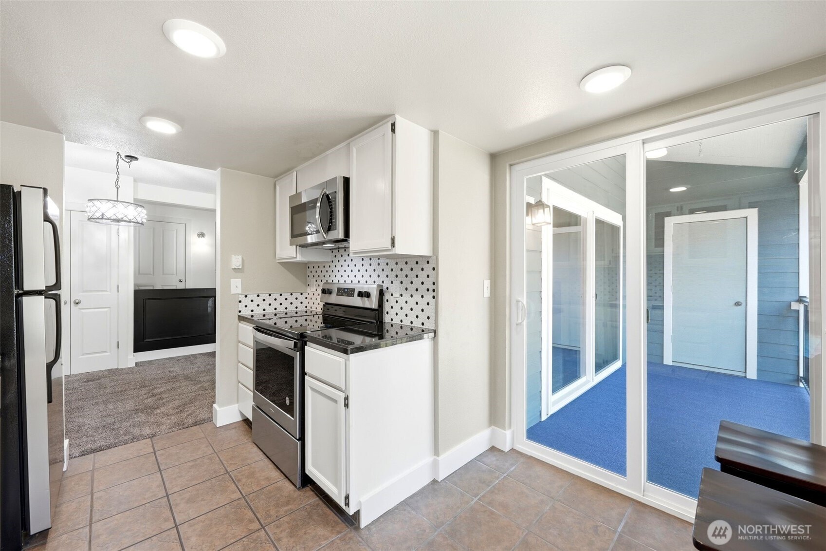 The dining area with pantry/appliance closet
