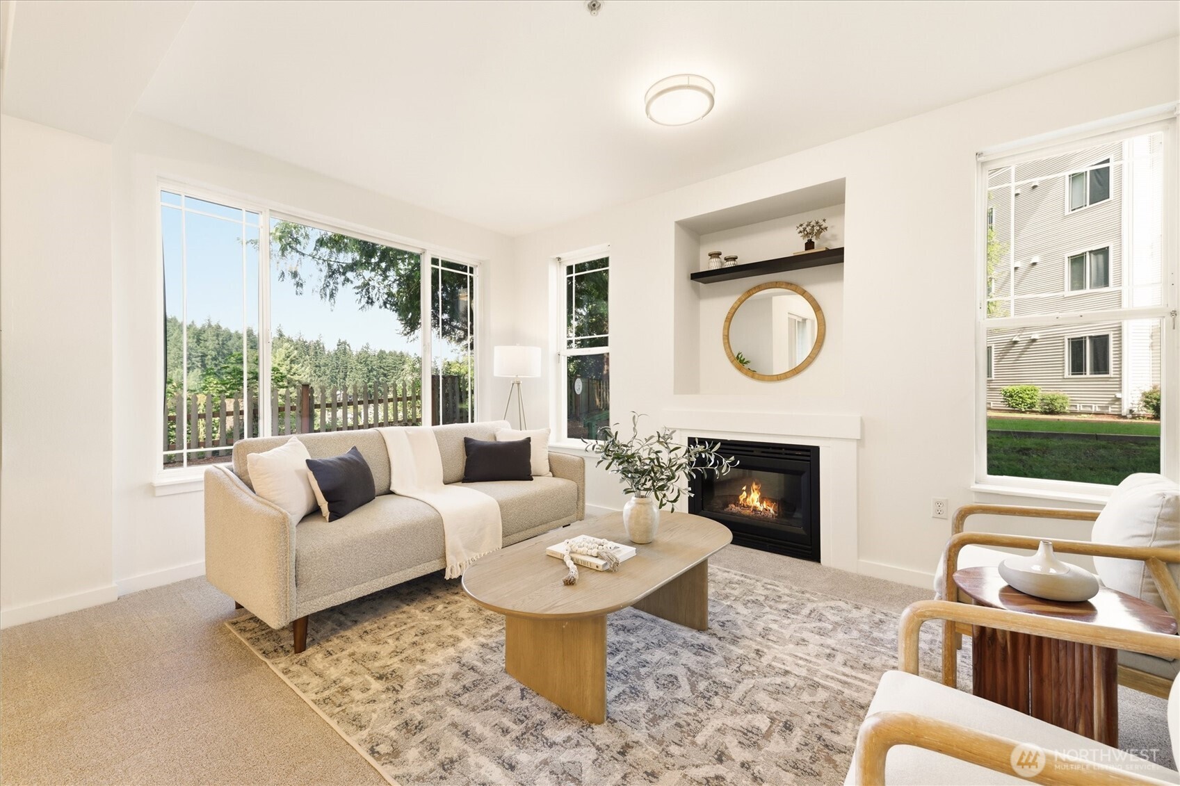 Walls of windows and a fireplace.