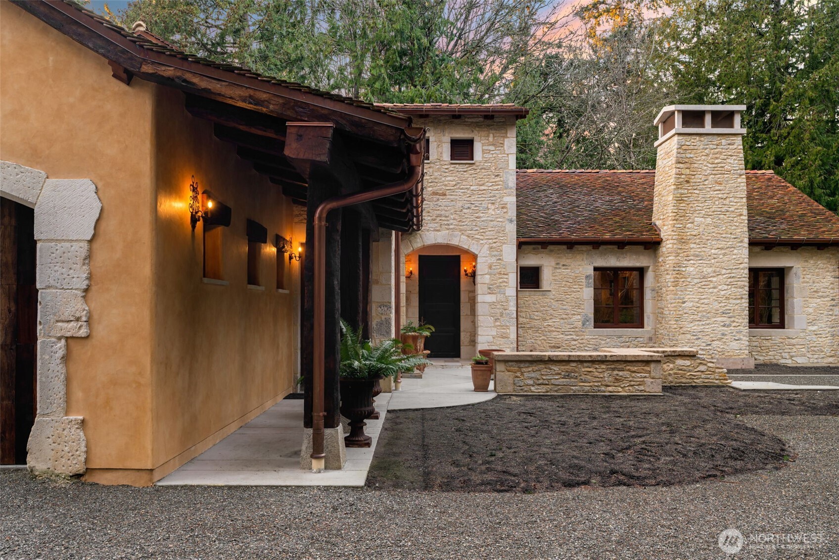 Antique French clay roof tiles installed for enduring beauty and longevity.