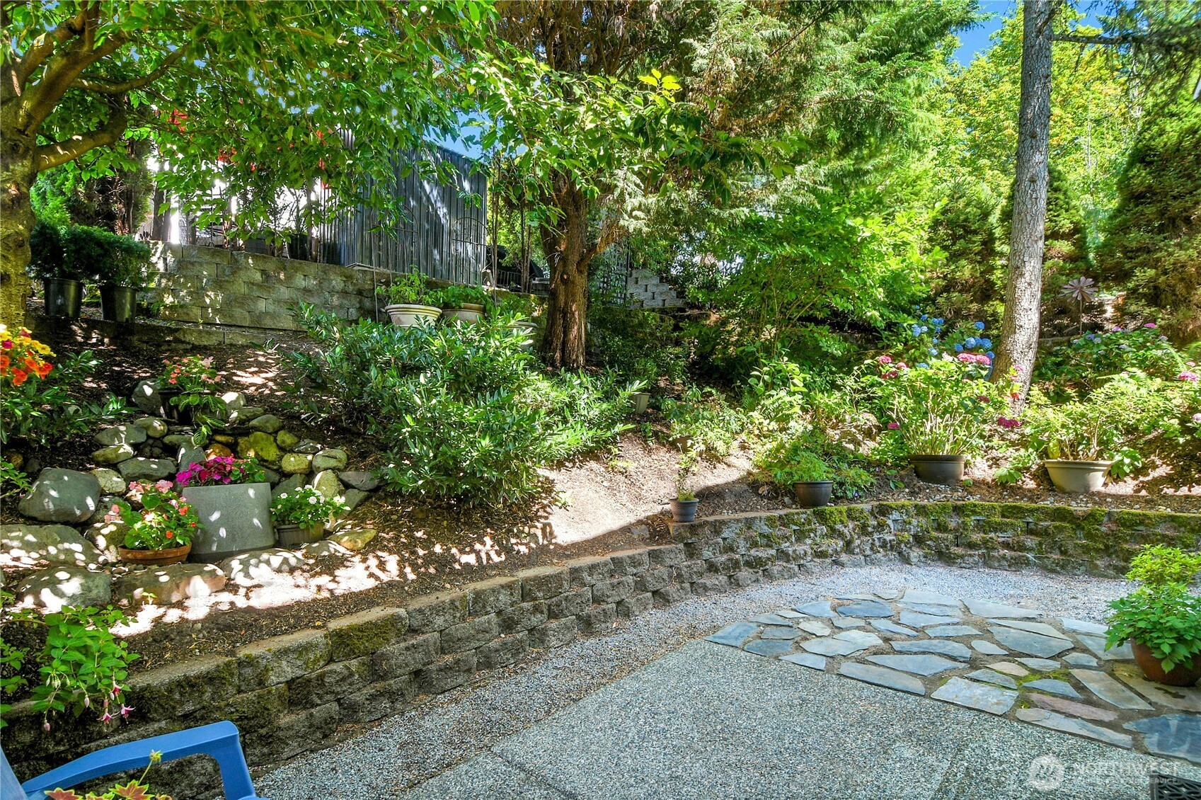 Aggregate and flagstone patio with Arboretum landscaping.