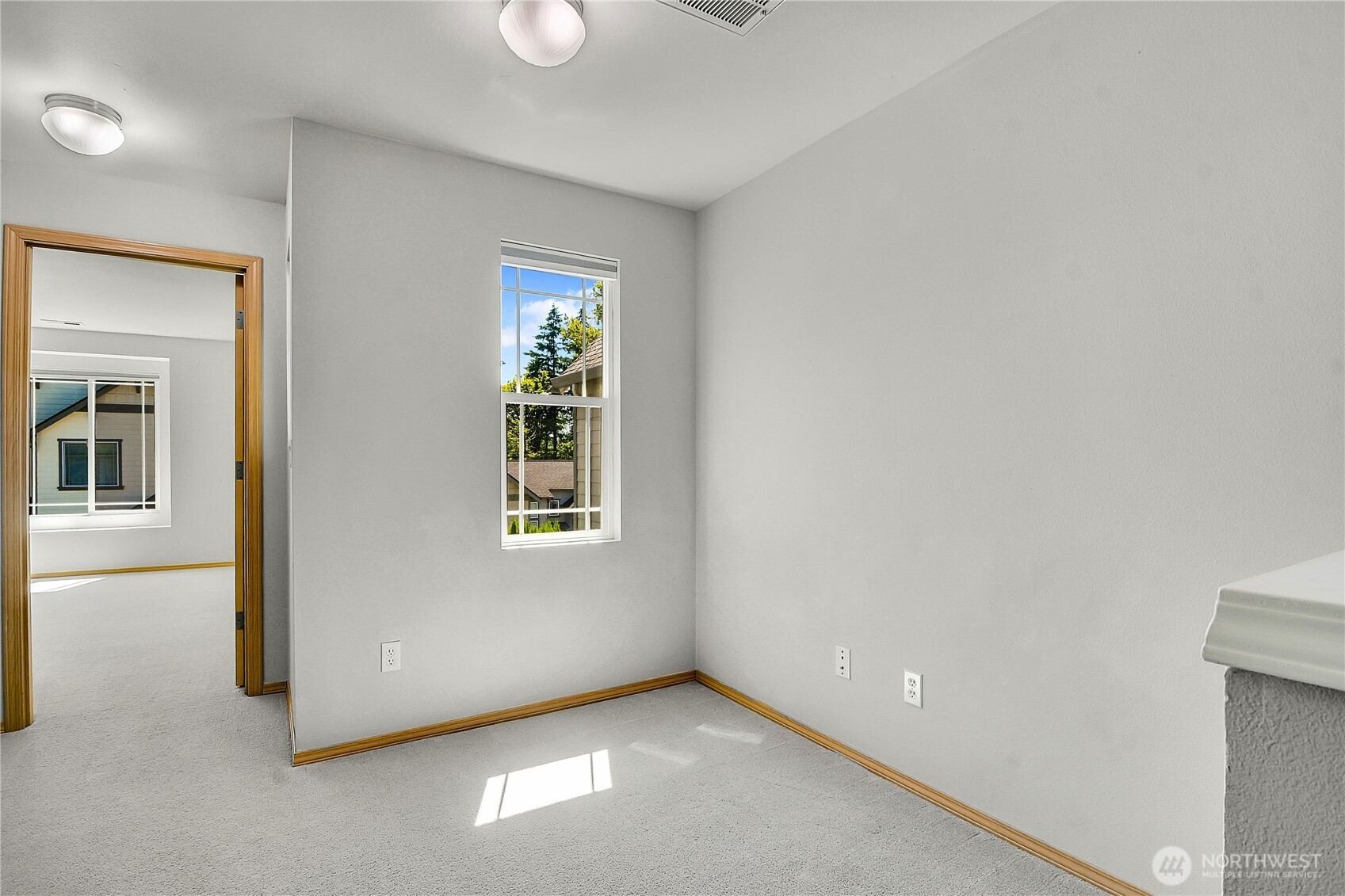 Open hallway. Computer workspace niche. Window with pulldown shade.
