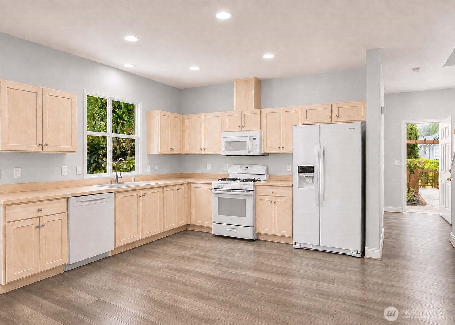 Entry interior leads to kitchen and Great Room living area. Kitchen with newer appliances. Premium Plank “Dora Walnut” flooring throughout the main level (2020). High 9-ft ceilings throughout main level. Entry area with 9-ft high ceiling. App-controlled Nest® Smart thermostat.