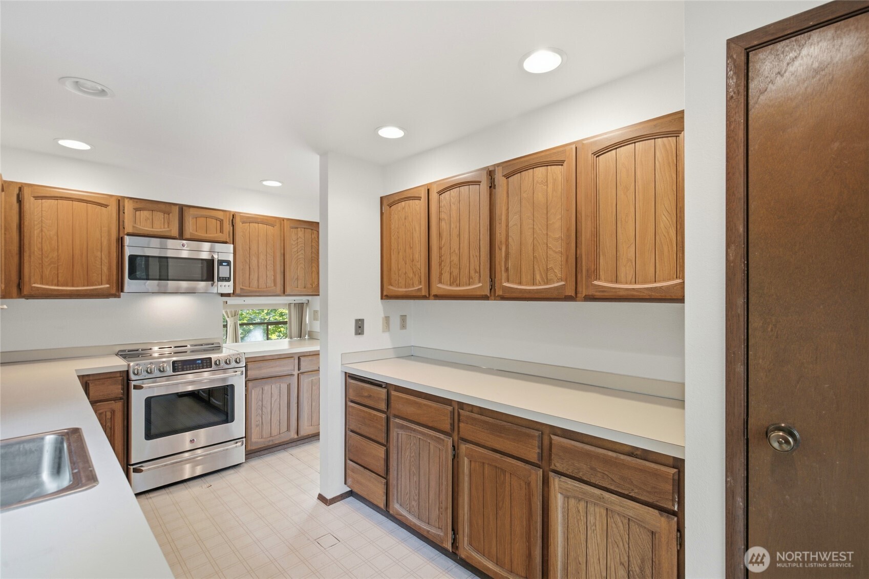 Kitchen with generous cabinet storage and counter space.