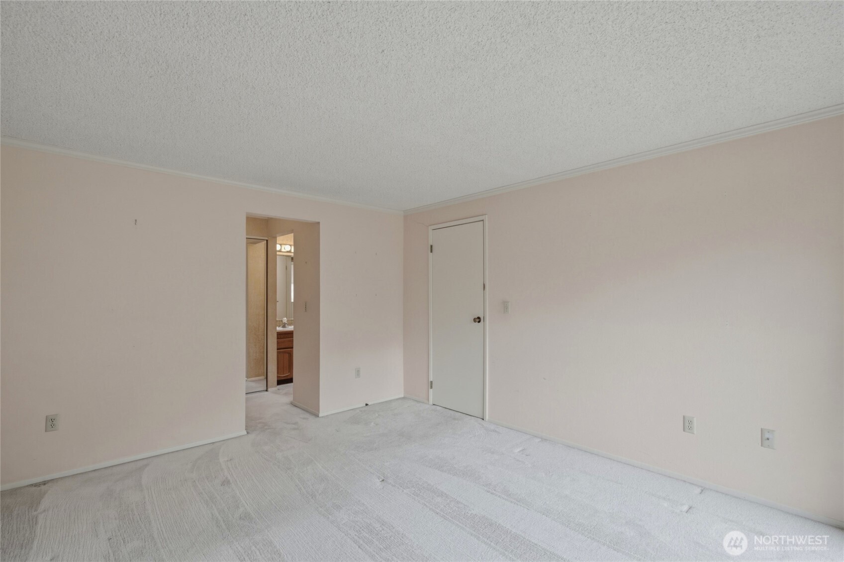 Bedroom with closet and a quiet outlook.