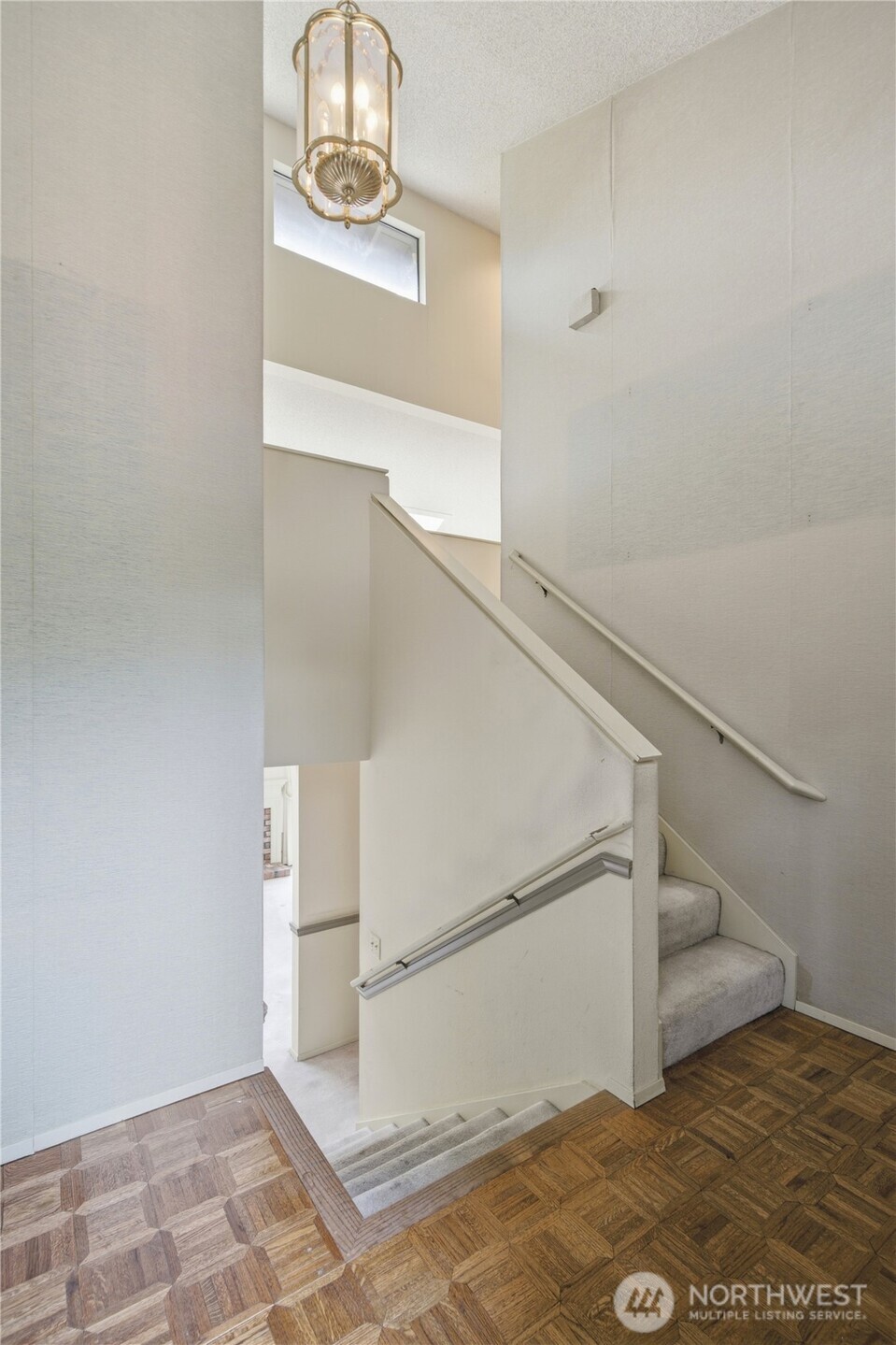 Entry landing with stairs to both levels.