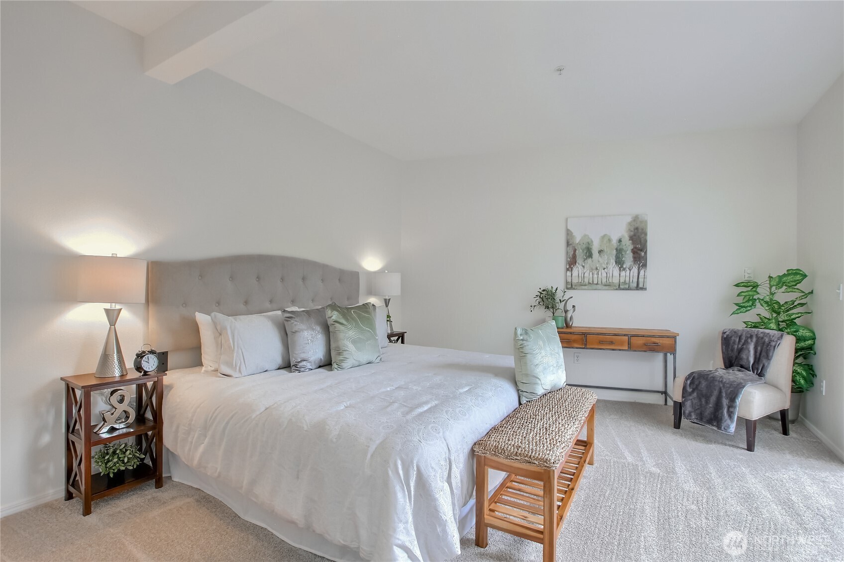 Spacious main bedroom with doors to patio and XL walk in closet.