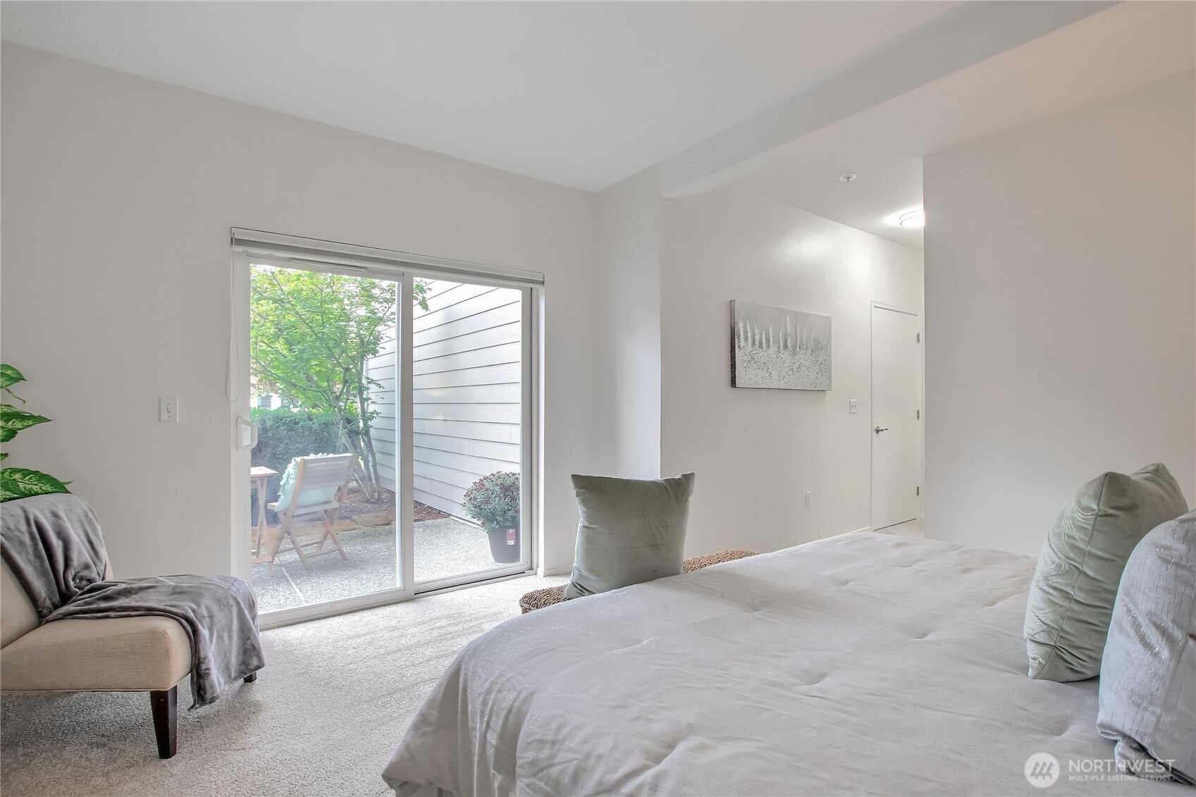 Primary bedroom opens to spacious patio.